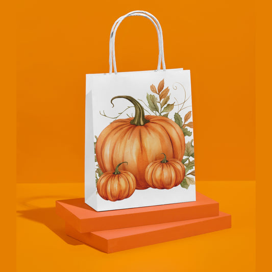 White paper bag with pumpkin design on an orange background
