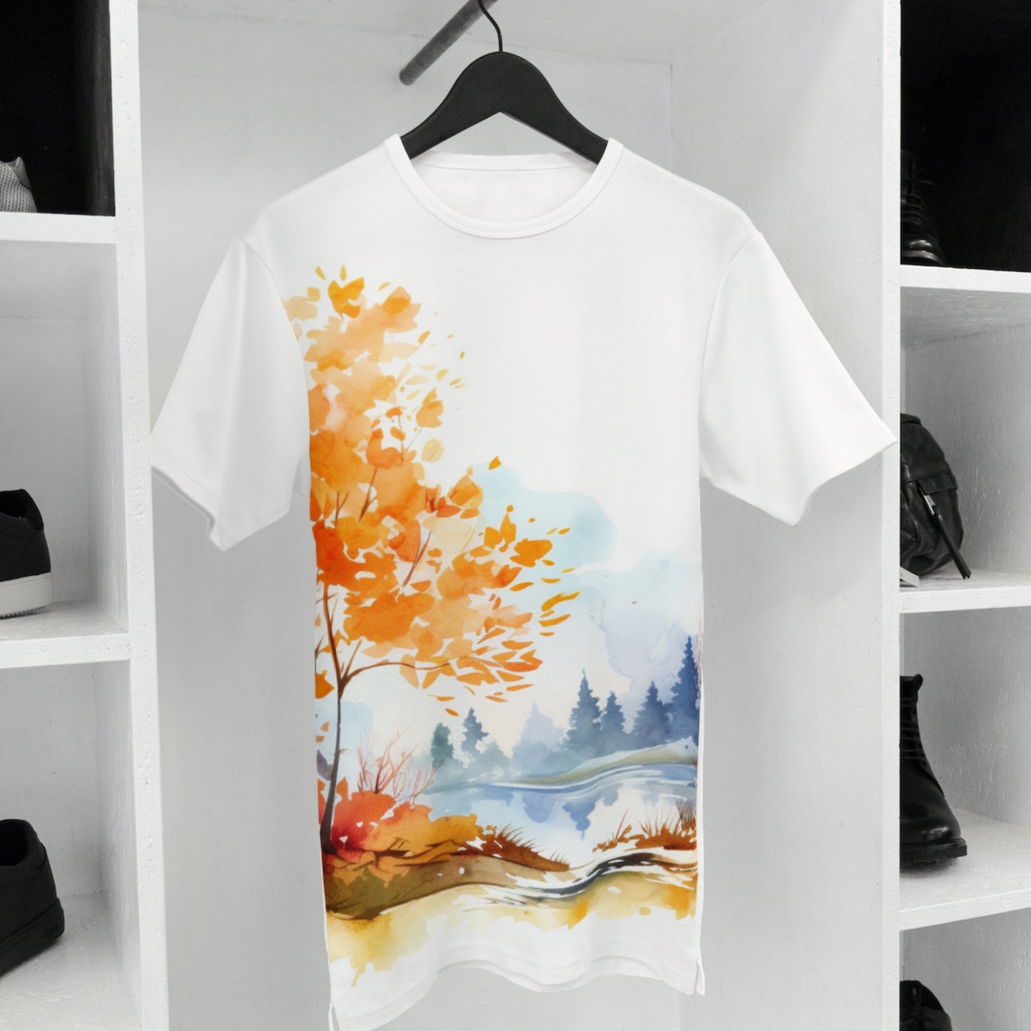 White t-shirt with autumn landscape design on a hanger against a white background