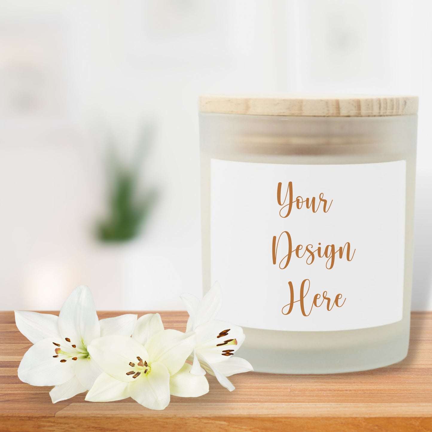 Candle with a customizable label on a wooden surface with white flowers.