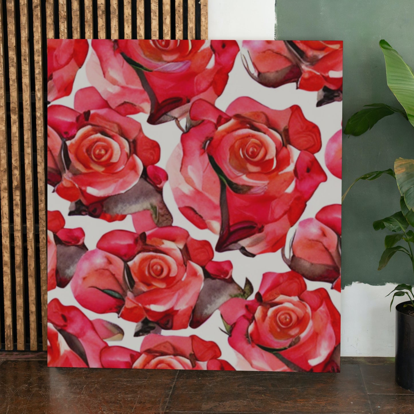Canvas print of red and pink roses on a white background, leaning against a wall.