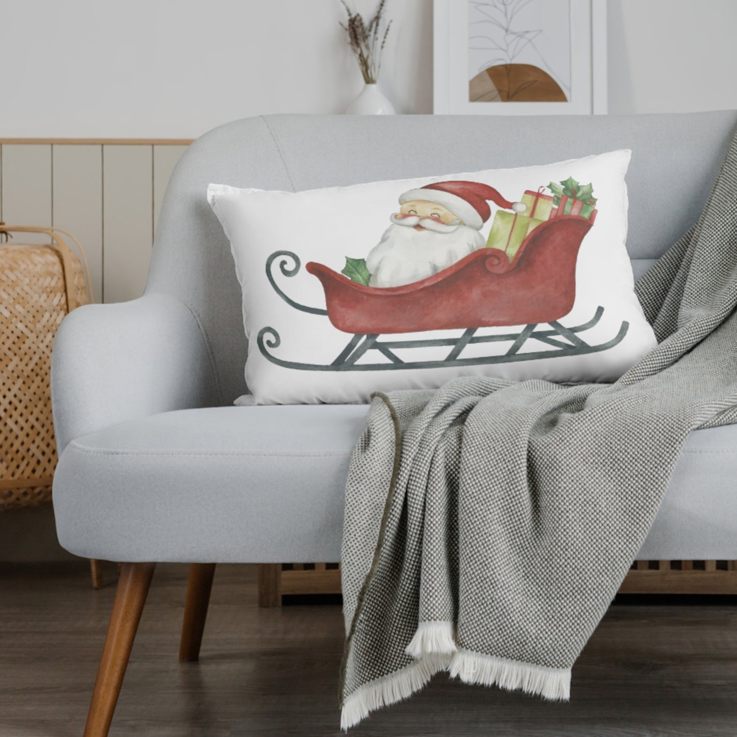 Decorative pillow with Santa Claus design on a gray sofa