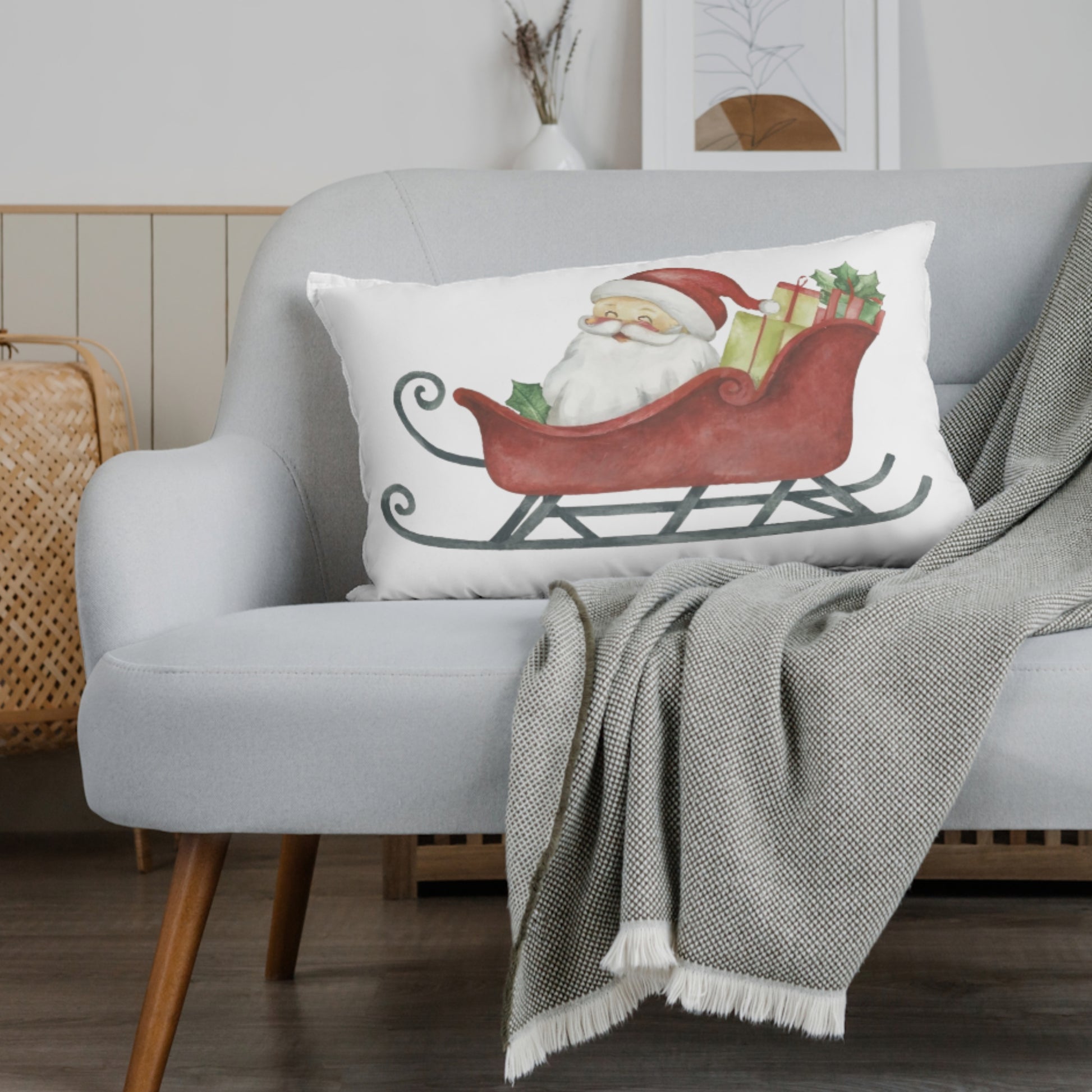 Decorative pillow with Santa Claus design on a gray sofa